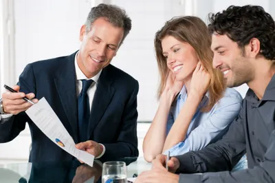 Insurance agent reviewing general liability policy with client in Destin