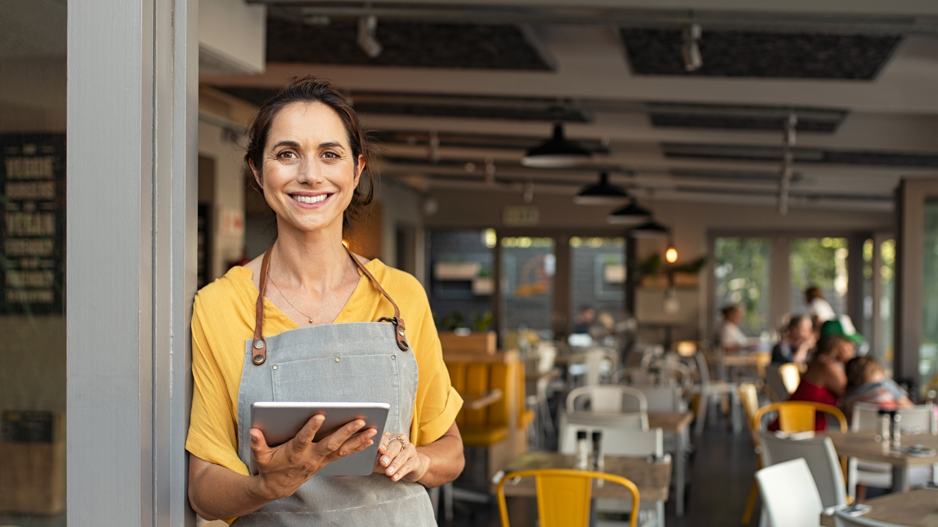 Restaurant owner standing in front of her business in Panama City Beach